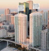 a view of a city with tall buildings and a bridge