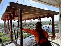 a worker is working on a construction site