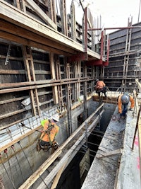 a group of construction workers are working on a construction site